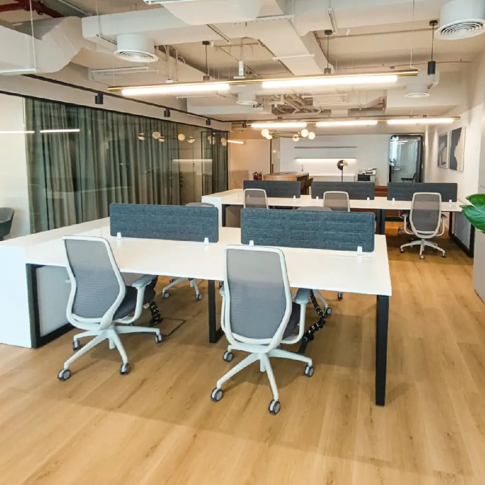 Open-plan workstation area with skyline views and ergonomic layout