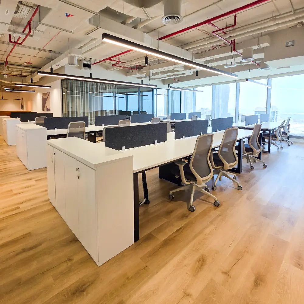 Open-plan workstations with panoramic windows in Sky Tower office