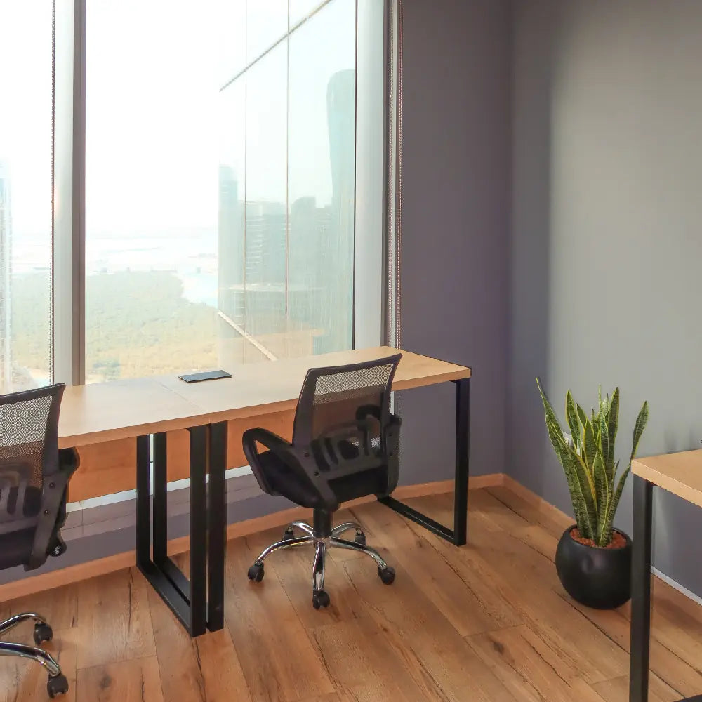 External 3-person office with large windows and ergonomic desks at The Work Oasis, Sky Tower, ADGM