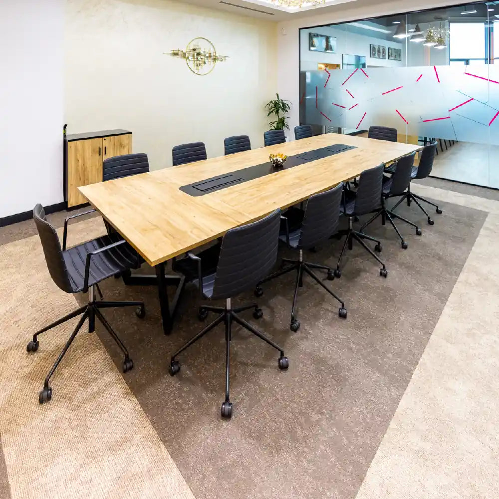 Large boardroom seating 12 with contemporary furniture at Austria Business Center, Al Hudaiba Mall