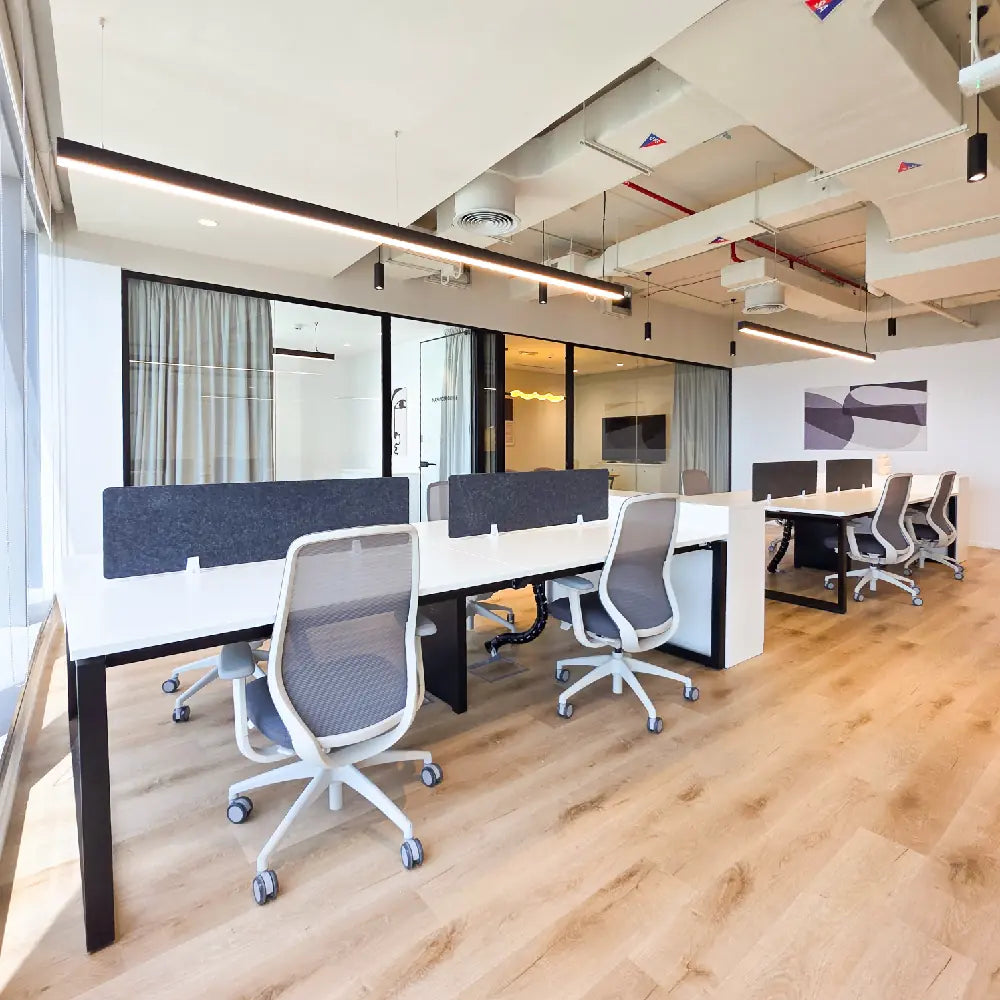 Side angle of collaborative workspace near manager offices