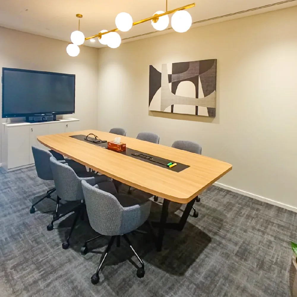 Fully equipped meeting room with AV screen and seating for six