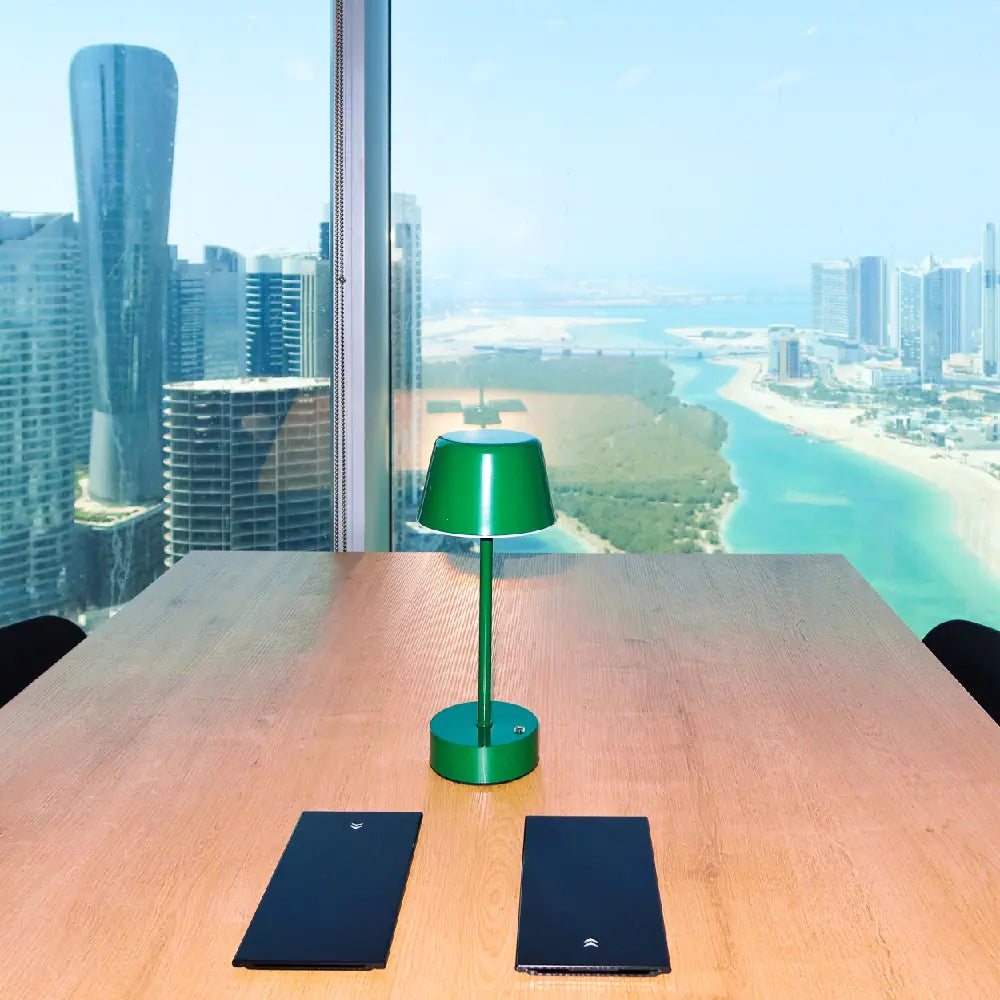 Shared workspace with panoramic Abu Dhabi views at The Work Oasis, Sky Tower, ADGM.