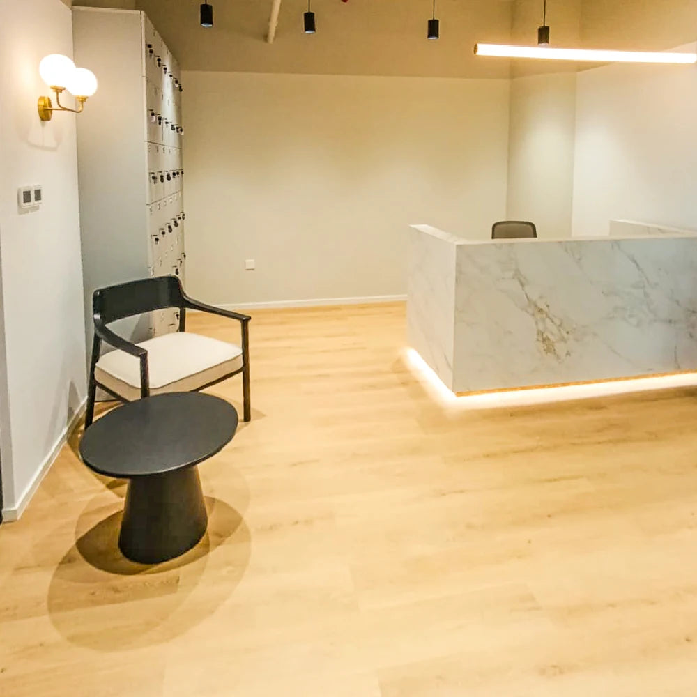 Marble reception desk with soft lighting and integrated locker storage