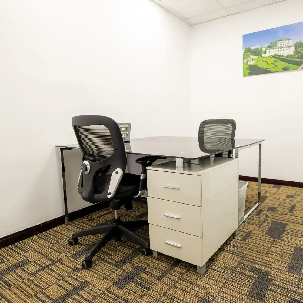 Internal 2-person furnished office with modern desks and chairs at Austria Business Center, Concord Tower.