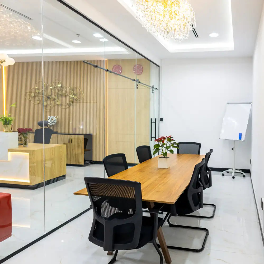 Meeting room for 6 people with modern furnishings at Austria Business Center, Al Hudaiba Mall.