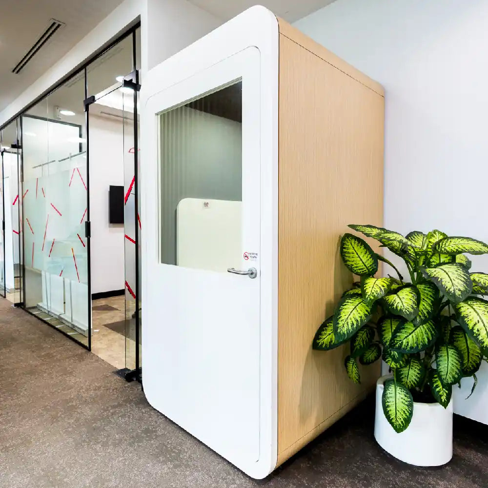 Private soundproof phone booth with chair for calls at Austria Business Center, Al Hudaiba Mall