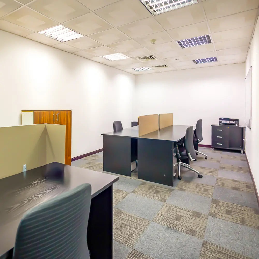 External 8-person private office with desks and chairs at Austria Business Center, Concord Tower.