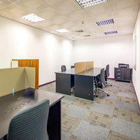 External 8-person private office with desks and chairs at Austria Business Center, Concord Tower.