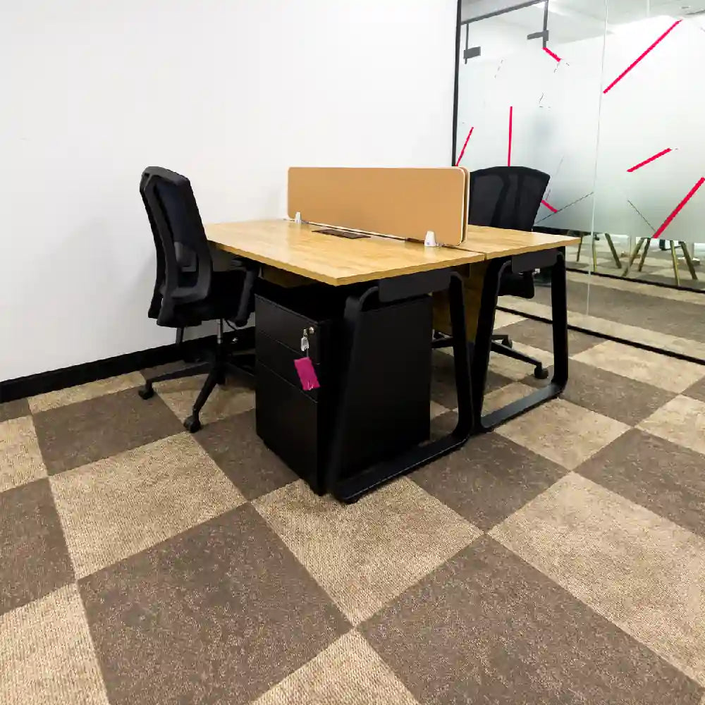 Internal 2–3 person serviced office with desks and chairs at Austria Business Center, Al Hudaiba Mall.