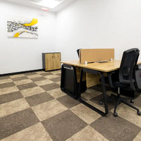 Compact internal office for 2–3 people with modern desks at Austria Business Center, Al Hudaiba Mall.