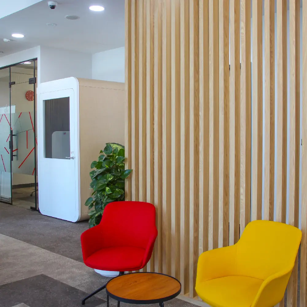 Soundproof phone booth with chair for private calls at Austria Business Center, Al Hudaiba Mall