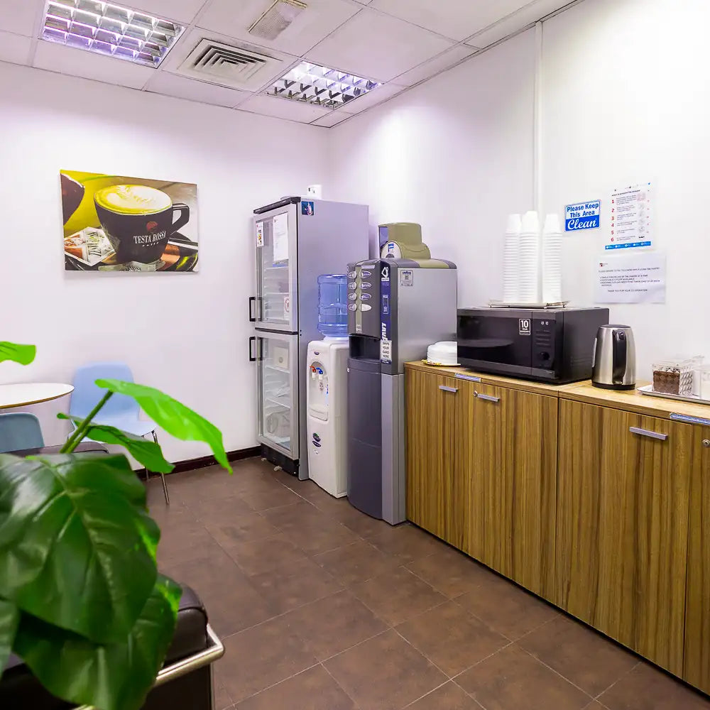 Shared kitchen with coffee, tea, and appliances at Austria Business Center, Concord Tower