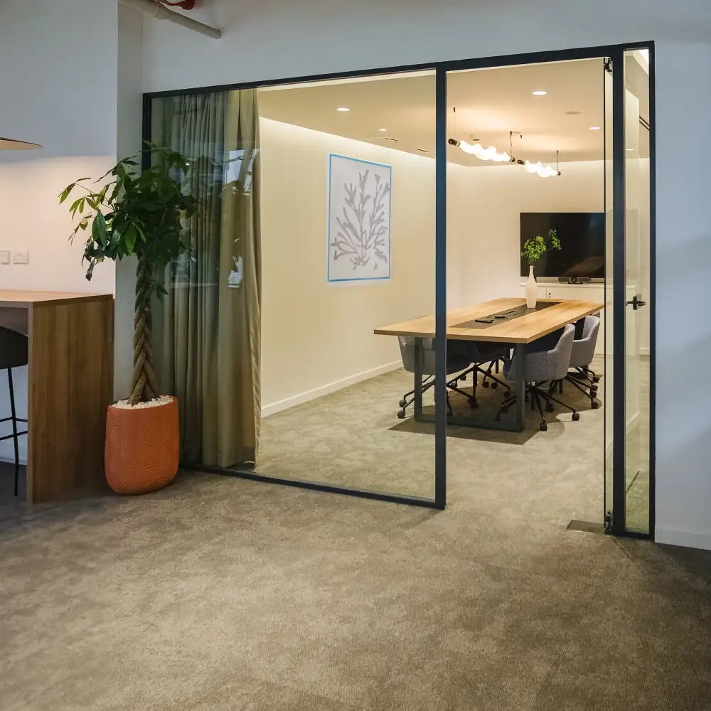 6-person glass-walled meeting room with modern decor at Rice – Al Salam Tower