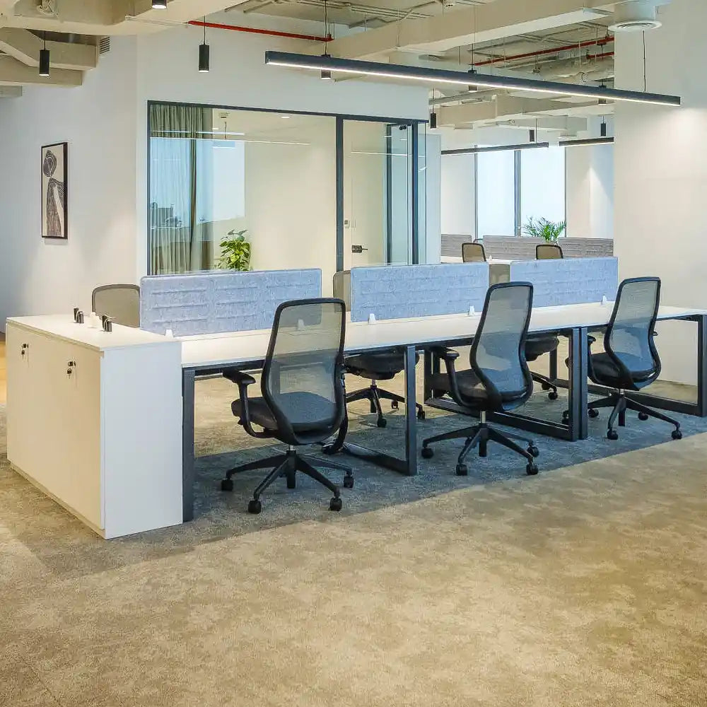 Open-plan workstations with large windows and natural daylight at Rice – Al Salam Tower