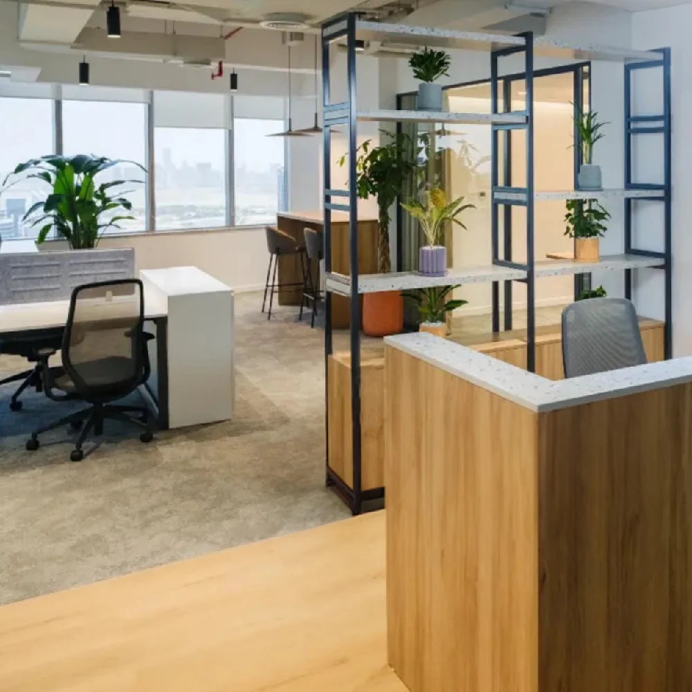Reception area with views of shared workstations and bar-height hot desk