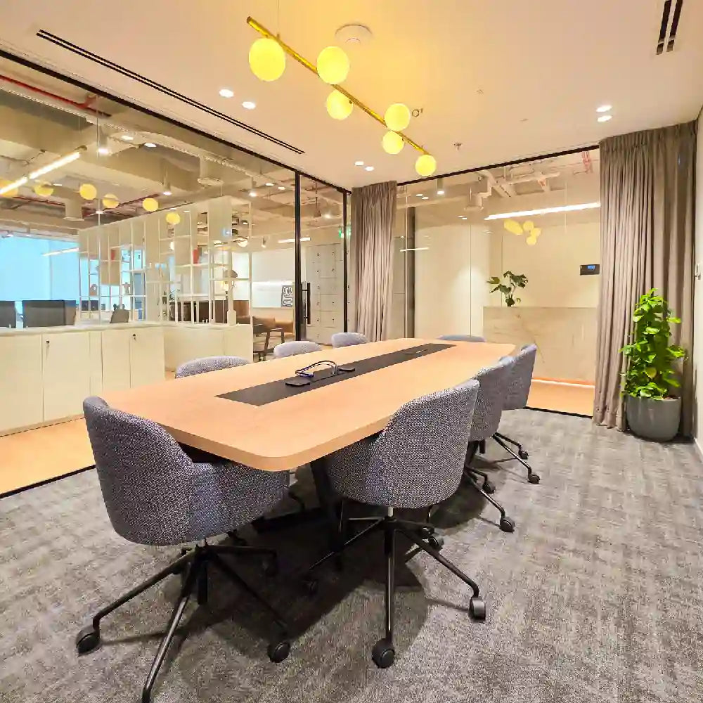 In-suite meeting room with board table and screen