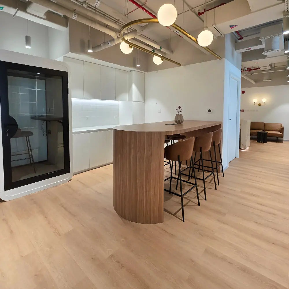 High-top breakout seating and built-in kitchenette in lounge zone