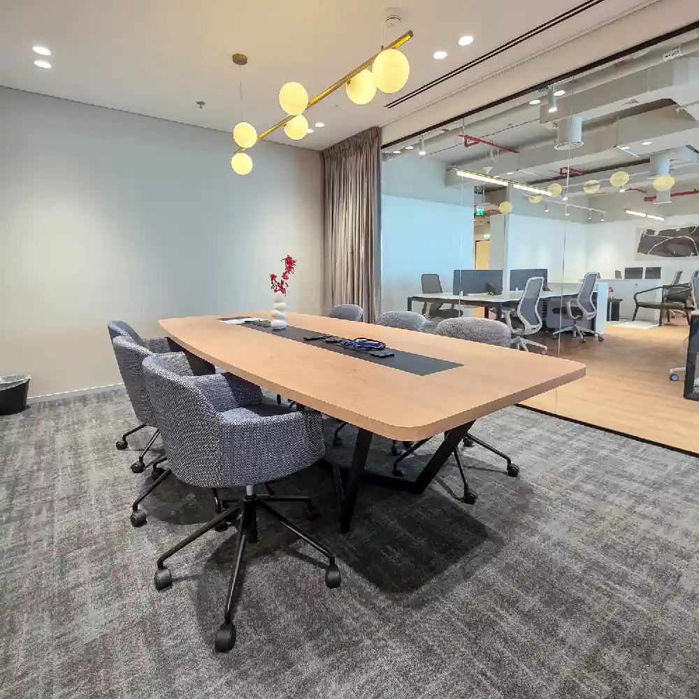 Fully furnished boardroom with screen, glass walls and AV setup