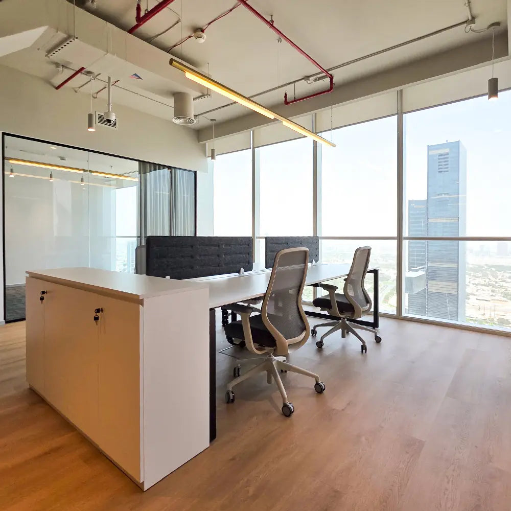 Natural light streaming over modern workstation layout in Burj Al Salam