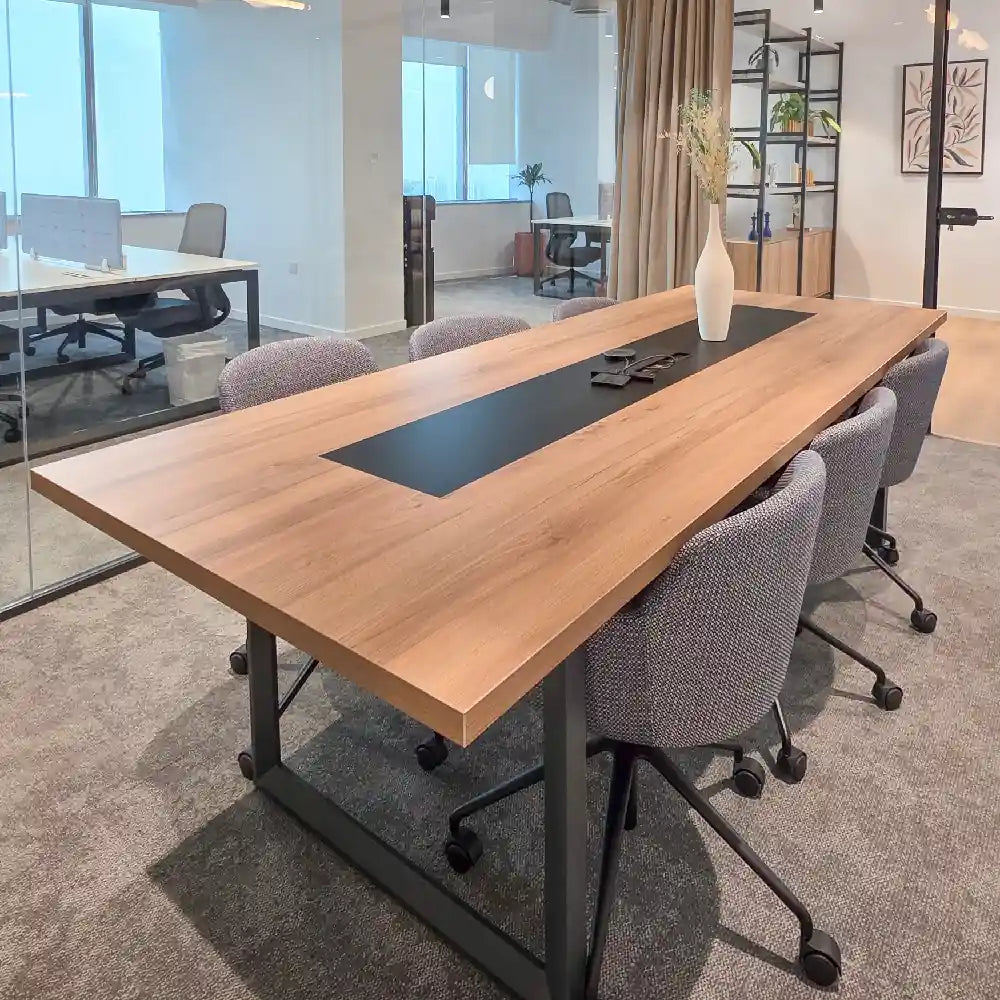 Six-person meeting room with wood table and glass walls in private office