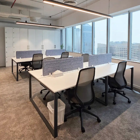 Open-plan private office with Sheikh Zayed Road views and natural daylight