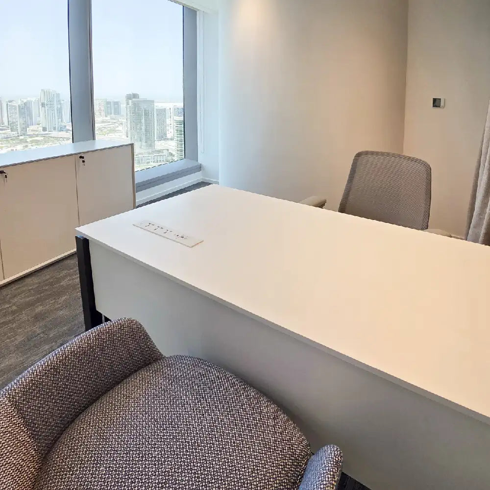 Executive corner setup with city views and storage cabinets