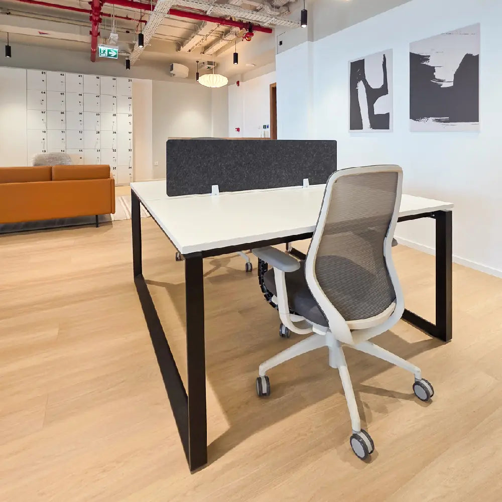 Compact single workstation near lockers and seating area