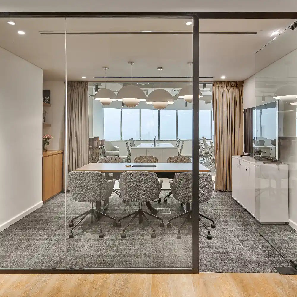 Full meeting room with boardroom table and pendant lighting