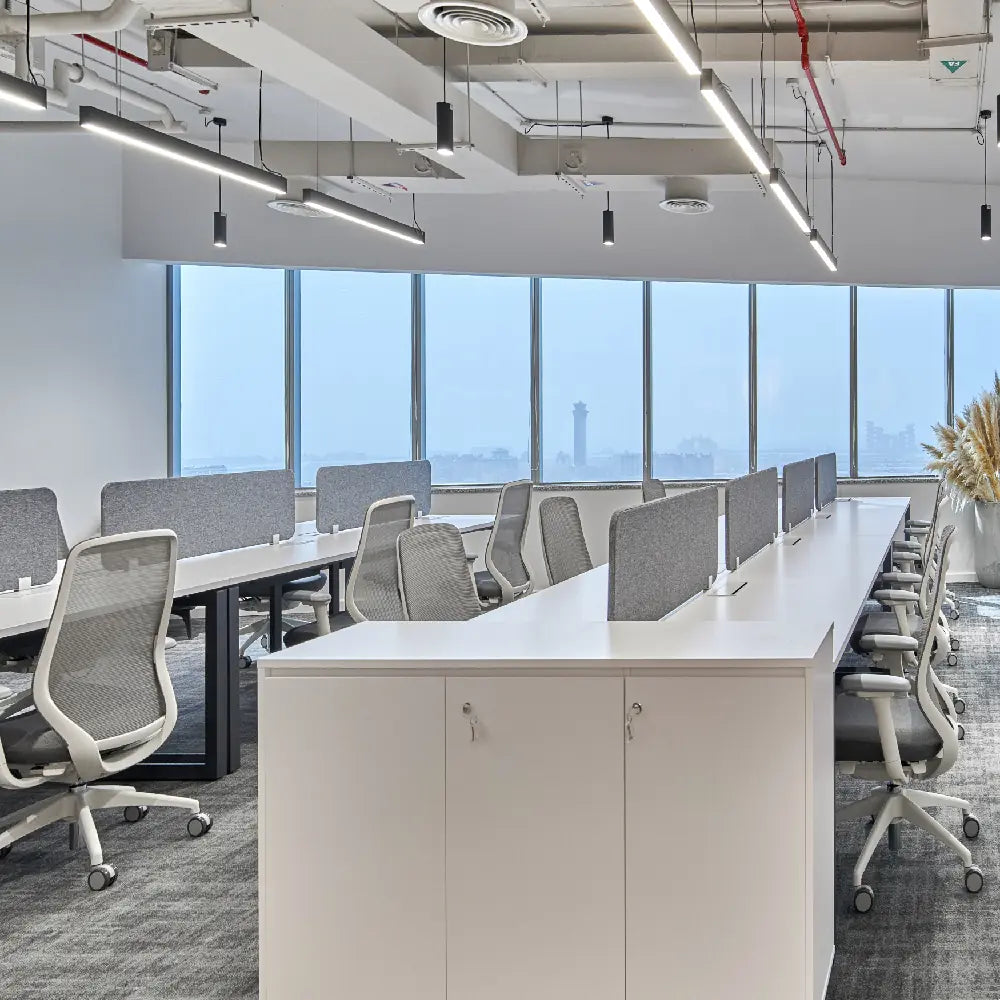 View of workstations with sea-facing windows in SPACE1 Al Salam Tower
