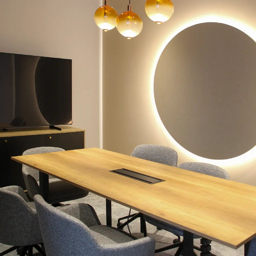 Boardroom table and chairs with TV and pendant lights